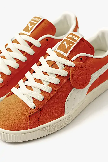Close-up of PUMA x Charles F. Stead Suede in Orange Glo shade