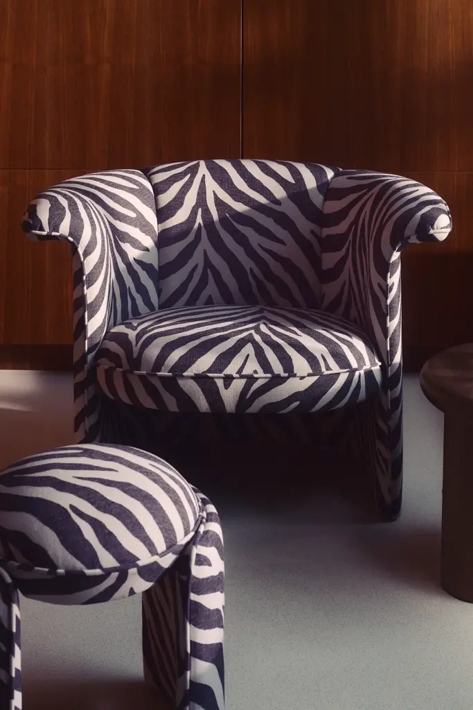 Zebra print lounge chair with matching stool